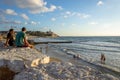 People enjoy sunset at the Charles Clore Beach, in the background St PeterÃ¢â¬â¢s Church in Old Jaffa